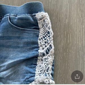 Adorable Hudson Denim Shorts with macrame along the sides and bottom hem.